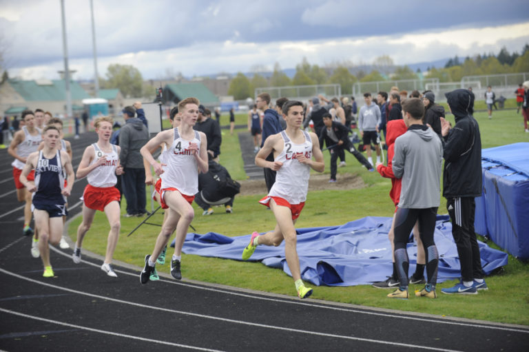 Camas senior Jackson Lyne (right) and sophomore Sam Geiger (second to right) lead the pack in the 1,600-meter event at Skyview High School on April 16.