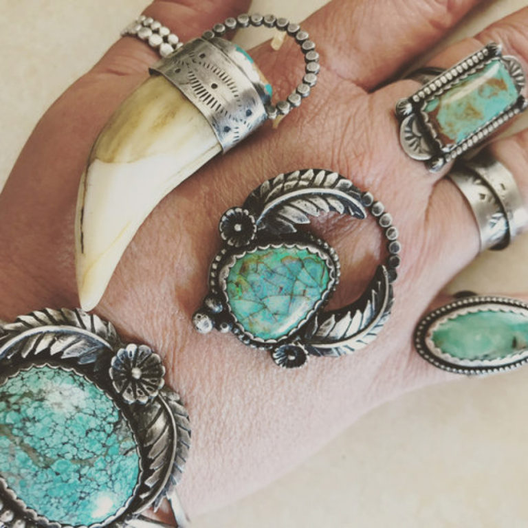 Rings and pendants crafted by Washougal jewelry artist Katy Fenley decorate a hand.