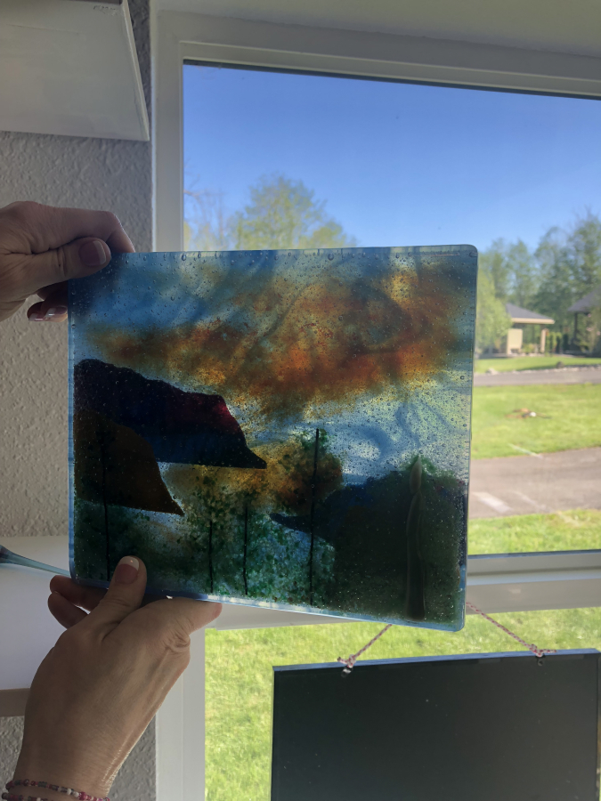 Washougal glass artist Shirley Bishop shows a landscape she created using a fused-glass method.