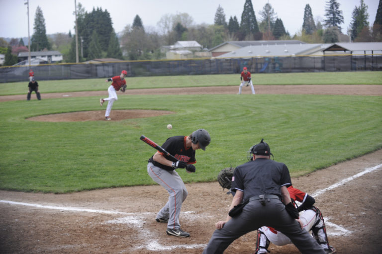 Washougal sophomore Gabe Kent takes one for the team as he earns a trip to first base after getting hit by a pitch in a win against R.A.