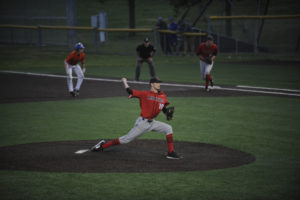 Riley Sinclair pitches out of touble and gets a strikeout with runners on first and second in the sixth inning against Auburn Mountainview.