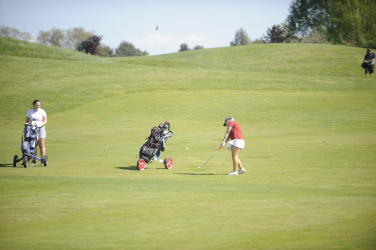 Ashley Clark puts her mid-range game to good use at Tri-Mountain Golf Course in Ridgefield during the first day of the 4A district tournament.