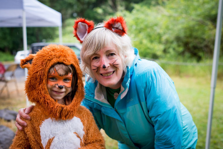 TreeSong executive director Michelle Fox (right) greets &quot;a wild thing&quot; at a past Run Wild! event in Camas. TreeSong will host its fifth annual Run Wild!