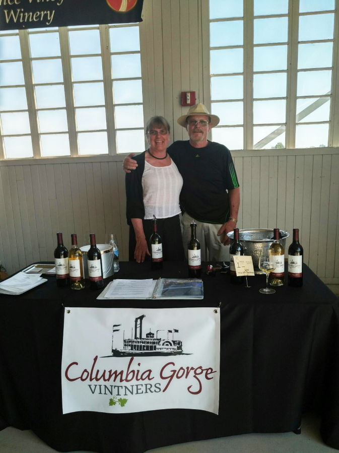 Cheryl (left) and Ray Hall (right) showcase their Columbia Gorge Vintners wines, produced from grapes growns, harvested and bottled at their Washougal winery, at the May 11 Savor Southwest Washington Wines event in Vancouver.