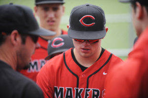 Camas senior Shane Jamison faces the final moments of his high school baseball career with the help of head coach Stephen Short on May 18 in Vancouver. 