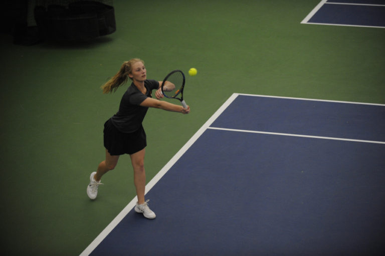 Washougal&#039;s Emily Johnson hits a return shot during the district tournament. Johnson and her doubles partner Elise Moore were one win away from a state tournament trip, falling to teammates Beyonce Bea and Paige Wilson in their last match.