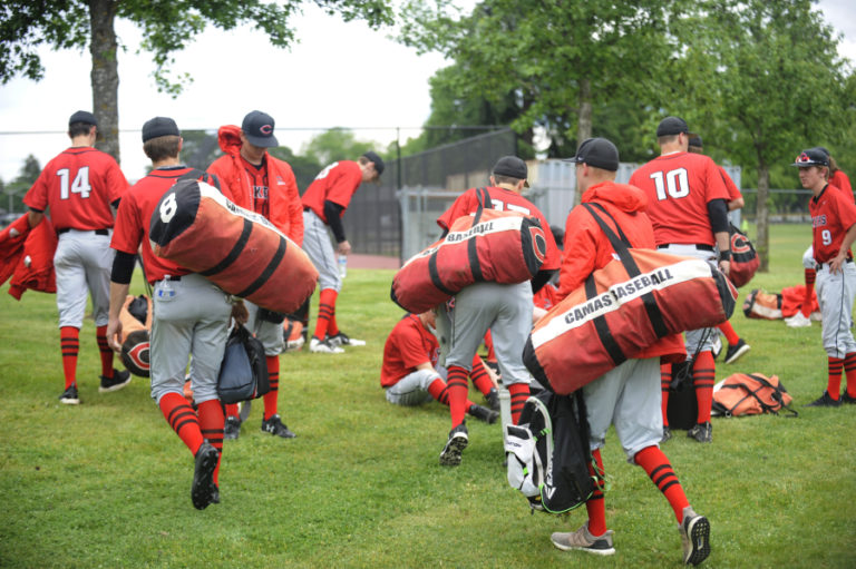 Camas baseball players pack up and say goodbye following a loss in the 4A state tournament at Propstra Stadium in Vancouver on Saturday, May 18.