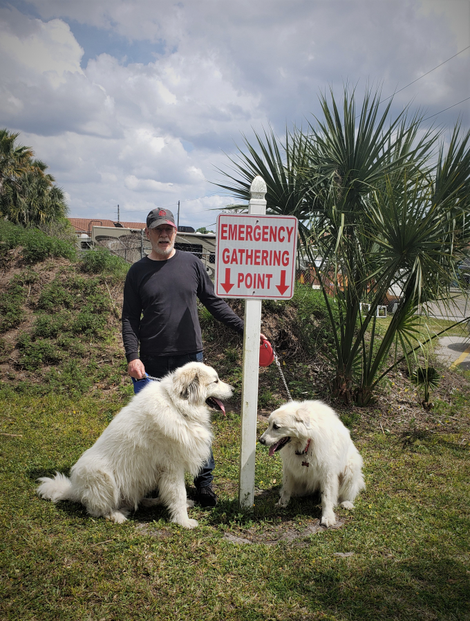 Spencer Blank, of Washougal, finds an “emergency gathering point” with his pups, Barrett and Gracie, in Florida.