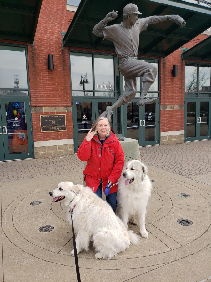 Kathy Blank, of Washougal, visits the Louisville Slugger Museum in Louisville, Ky., with her dogs Gracie (left) and Barrett (right).