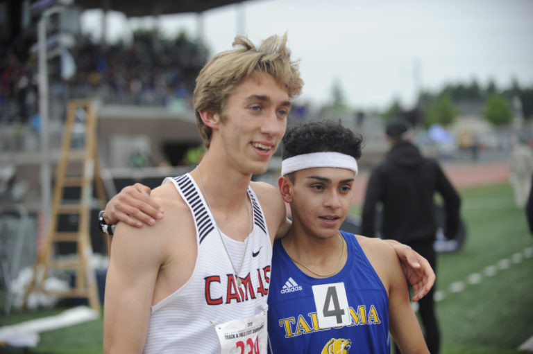 Camas&#039; three-time 800-meter 4A state champion Daniel Maton (left) poses with second-place finisher Brian Martinez (right) from Tahoma High School.