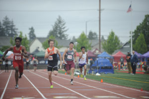 Washougal's Ryan Davy (second from left) anchors the 4x100 relay at the 2A state meet.  Washougal won the event after the top two teams were disqualified.