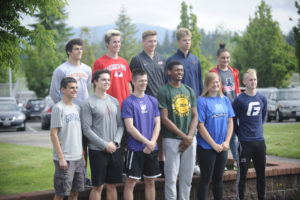 Camas High School letter-of-intent signees pose for pictures at a signing ceremony at the high school on May 29. (Wayne Havrelly/Post-Record)