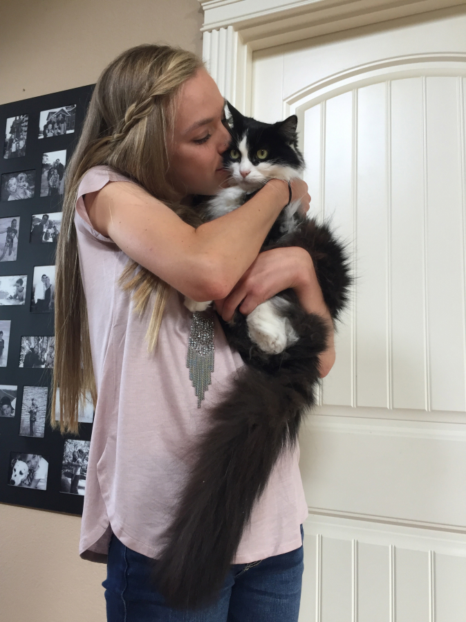 Washougal High valedictorian Amelia Pullen, pictured here with her 17-year-old rescue cat, will attend Warner Pacific University in Portland in the fall.