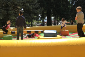 Children jump on an inflatable toy during the CamTown Youth Festival, held June 1, in Crown Park. The event, put on by the city of Camas, featured a variety of games, crafts, activities, entertainment, food, an art show, a petting zoo and a children's flea market. (Doug Flanagan/Post-Record)