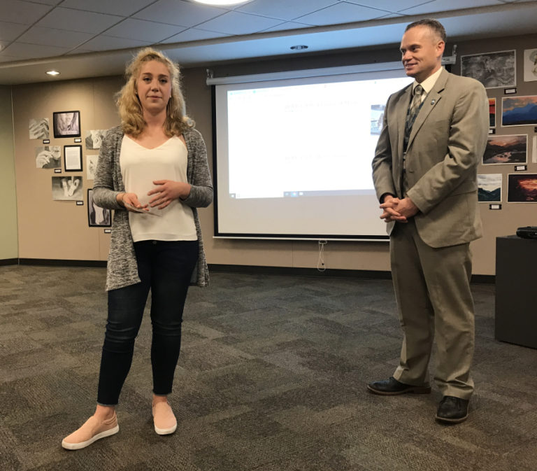 Camas High School senior Sophia Hansen receives a &quot;Mill Town Pride&quot; award from Camas School District Superintendent Jeff Snell during the Camas school board&#039;s meeting on May 28.