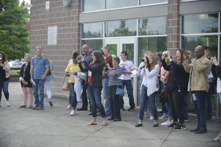 Parents record the moment as their children sign letters of intent at a signing cemeremony at Camas High School on May 29.