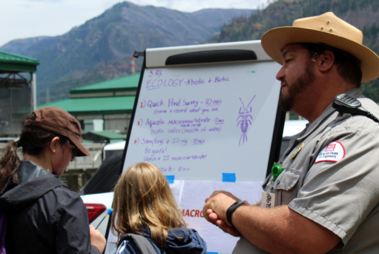 Army Corps of Engineers Ranger Ben Goodlad (right) talks about pond ecology with Washougal students on June 6.