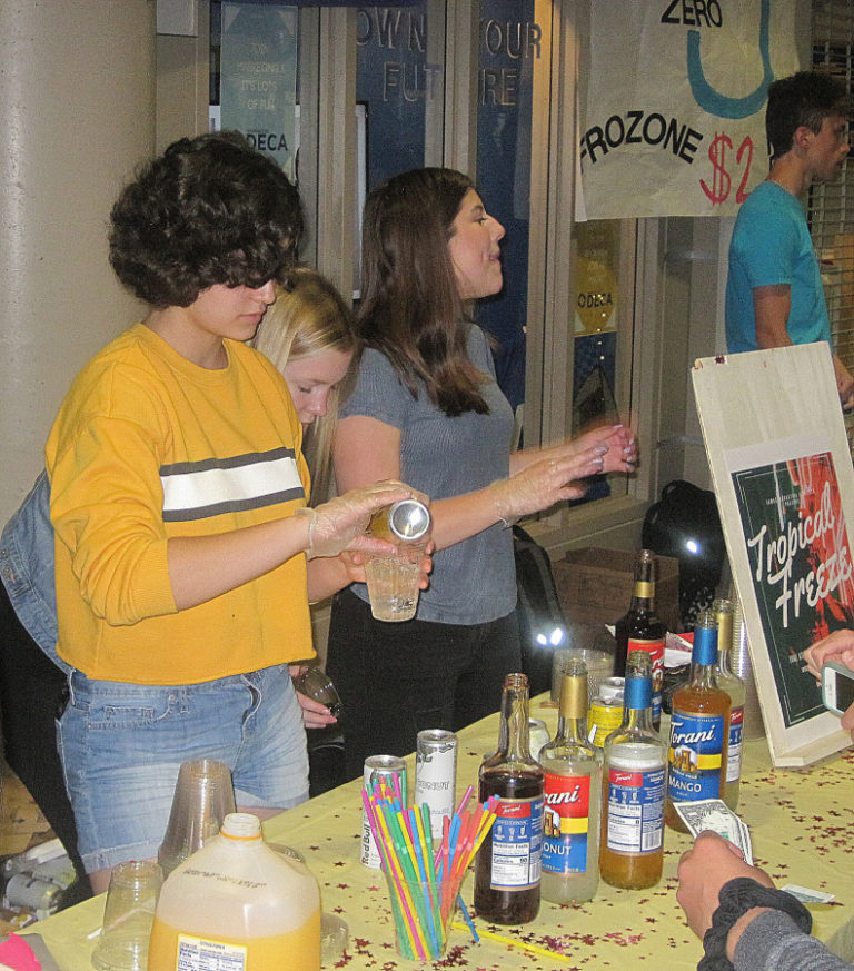 Danny Macias (left) prepares a &quot;Tropical Freeze&quot; with Kylie Shega (middle) and Courtney Borra during the &quot;Thirsty Thursday&quot; event June 6 at Camas High School.