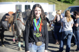Washougal sophomore Payton Robb shows off her state medals as she prepares for regional equestrian competition in Redmond, Ore., on June 14-16. (Photos by Wayne Havrelly/Post Record)