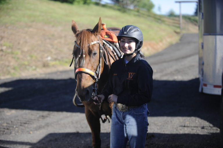 Washougal equestrian Karen Phelps unloads her horse Bobbi as they practice for the upcoming regional competition in Redmond, Ore.