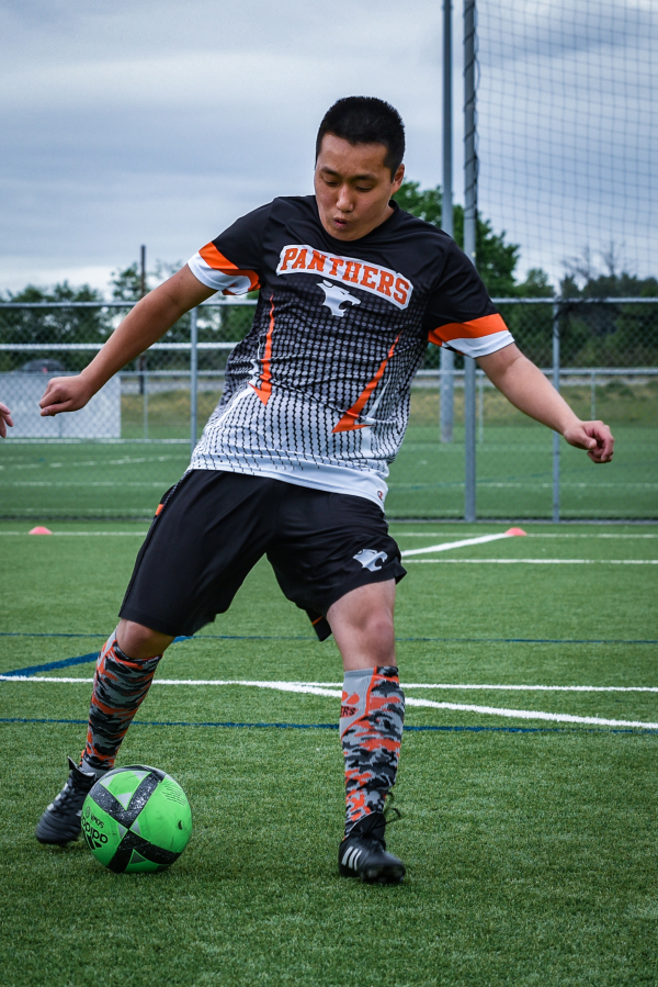 Kaden Graham shows off his ball dribbling skills during the state soccer tournament where Washougal High School&#039;s unified team took second place.