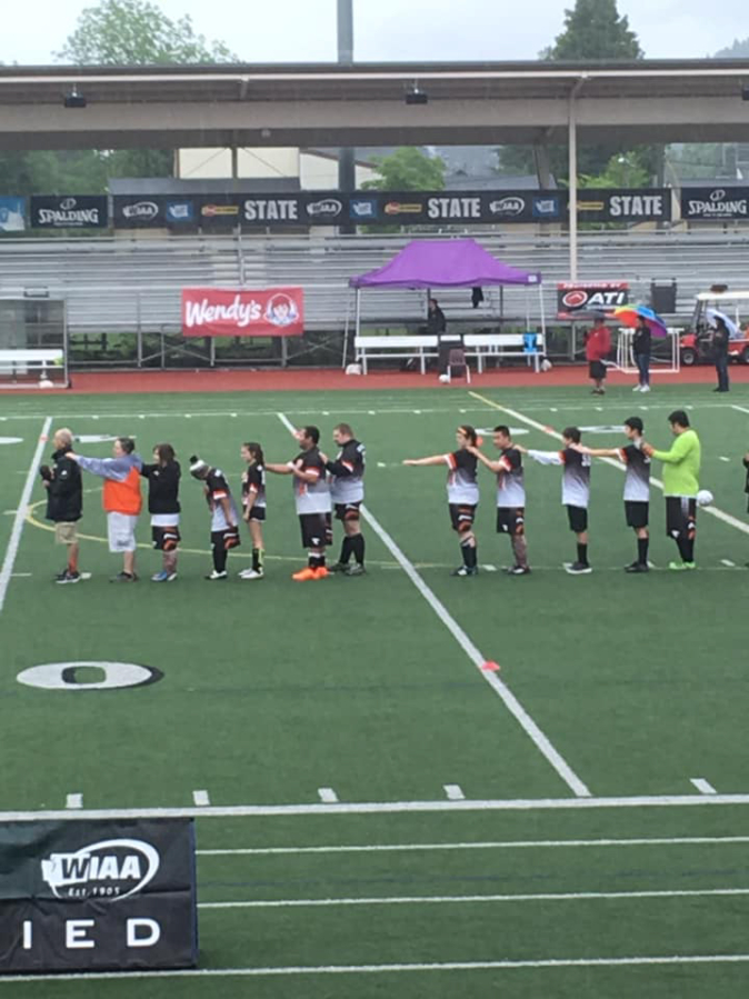 The Washougal High School unified soccer team shows their unitiy after taking second place at the Unified Soccer State Championship tournament, held May 25 in Sumner.