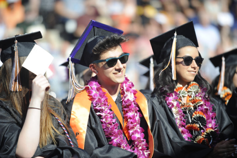 Washougal High School class of 2019 class president Kenny Kanthak (center) is all smiles at his graduation ceremony on June 8.