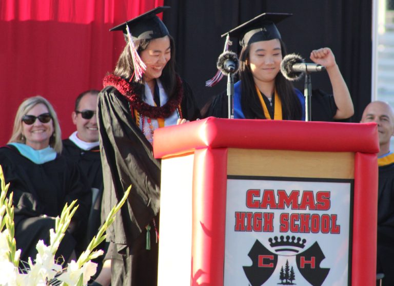 (Photo by Kelly Moyer/Post-Record)
Camas High School class of 2019 valedictorian Monica Chang (right) gives a fist pump during a speech she and salutorian Abigail Jiang (third from left) delivered at the June 14 Camas High graduation ceremony.