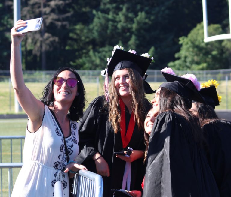 (Photo by Kelly Moyer/Post-Record)
Camas High School class of 2019 graduates pose for a selfie photo with a family member at Doc Harris Stadium, before their graduation ceremony on June 14.