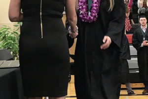 Hayes Freedom High School graduate Maggie Mack (right) shakes hands with Hayes Freedom principal Amy Holmes Saturday during the Hayes Freedom graduation ceremony at Lincoln Middle School on June 15. (Doug Flanagan/Post-Record)