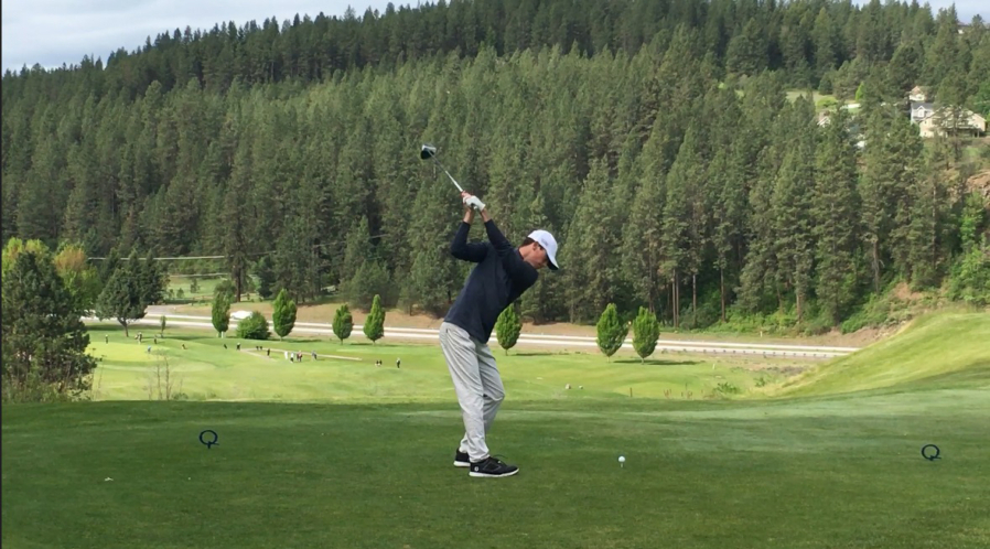 Owen Huntington hits a tee shot at The Creek at Qualchan Golf Course in Spokane during the 4A state tournament on May 21. Owen posted top-10 finishes at the 4A state tournament in his freshman and sophomore seasons, and said his younger brother Eli is just as good as him. (Contributed photo courtesy of Lee Huntington)