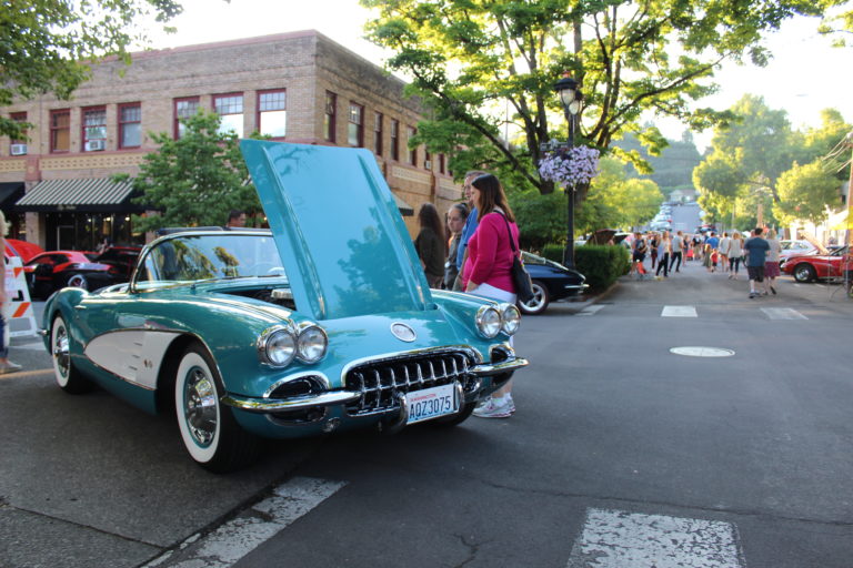 Camas Car Show visitors check out a 1960 Chevrolet Corvette, owned by Anna and Lloyd Fry of Washougal on June 29.