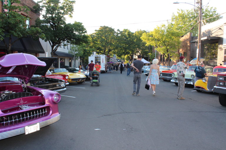 Visitors to the 2019 Camas Car Show, held June 29 in downtown Camas, stroll past a few of the 250 classic vehicles entered in this year’s 14th annual classic car show.