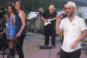 Members of Five Guys Named Moe, a Portland-based 12-piece show band, perform a song during the Port of Camas-Washougal Fourth of July Concert and Celebration, held July 4 at Washougal Waterfront Park. The event also featured The Junebugs, a Portland-based funk rock trio; food carts; a beer garden; and a fireworks display. (Doug Flanagan/Post-Record)