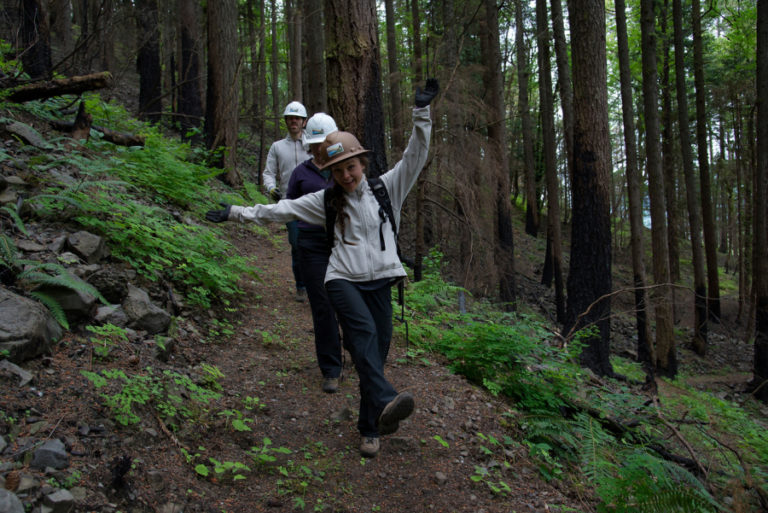 After a day of fixing trails, members of a Friends of the Columbia Gorge work party celebrate the moment.