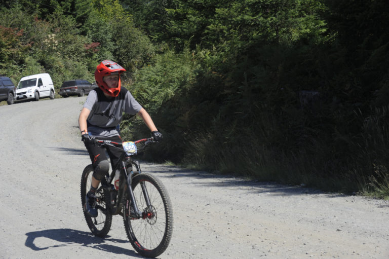 Ryan Roelofs, 13, from Bellingham, Wash., rides to his next race stage in the Yacolt Burn Enduro on Larch Mountain.