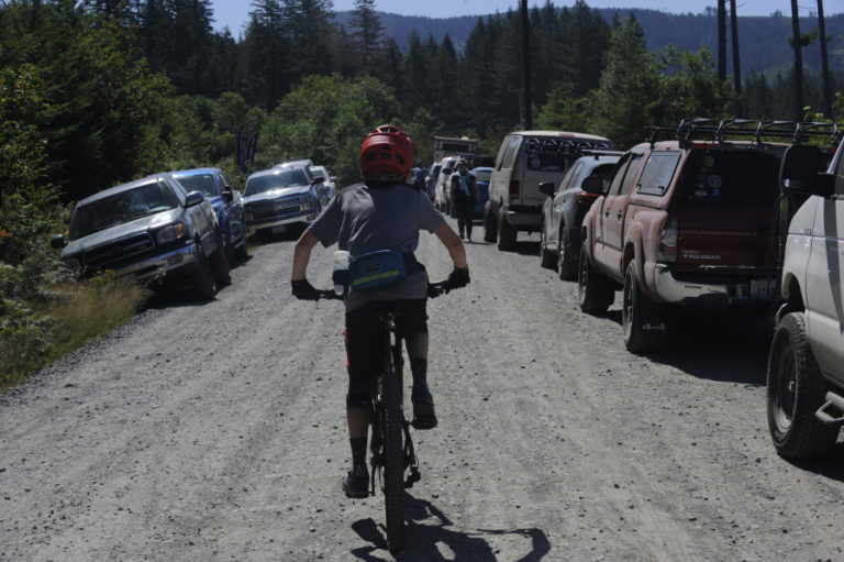 Photos by Wayne Havrelly Camas/Washougal Post Record 
  
 Trucks and vans line L-1000 near Cold Creek north of Camas on Saturday, July 20  for the 7th annual Yacolt Burn Mt. Bike Enduro.