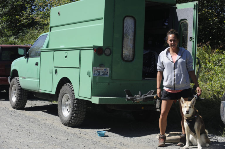 Photo by Wayne Havrelly 
  
 Gabrielle Worzella and her dog Lilly from Seattle camp out in a utility truck converted into an RV for bike racing, while her boyfriend Ryan Hales takes on the Yacolt Burn Enduro.