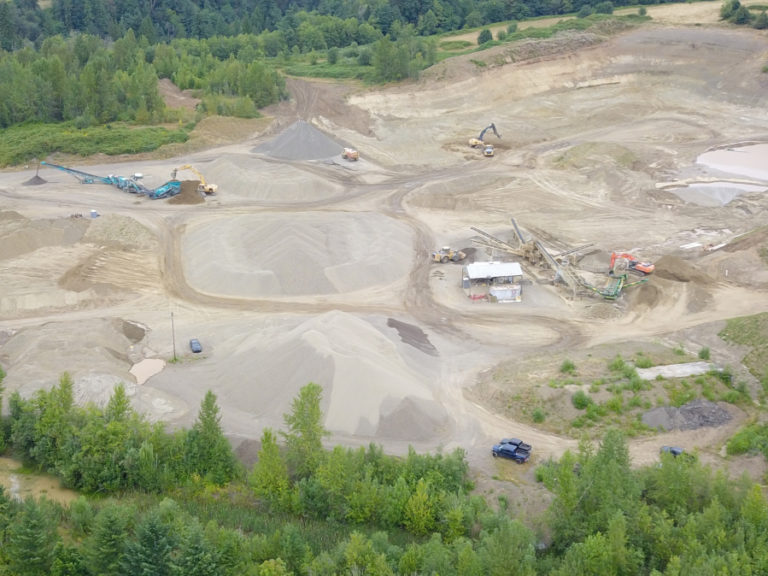A drone photo shows an overhead view of the Washougal Rock Pit, where Gorge advocates say illegal rock crushing is happening.