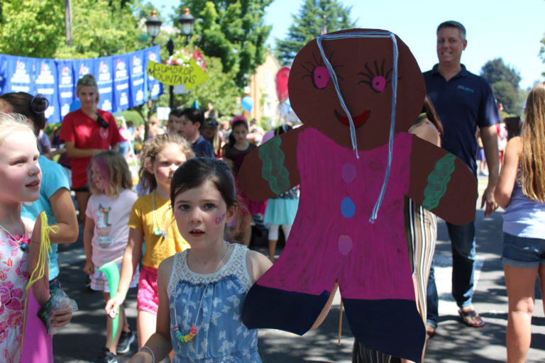 (Post-Record file photo) Children carry "Candyland" themed decorations down Northeast Fourth Avenue in downtown Camas  during the July 2019 Camas Days Kids Parade.