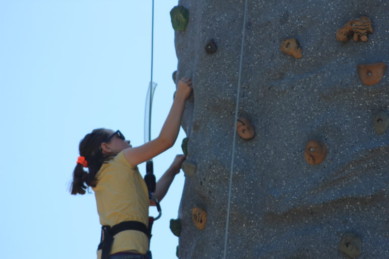 (Photo by Kelly Moyer/Post-Record) The rock-climbing wall proved to be a popular attraction at the 2019 Camas Days Kids Street. Here, a climber reaches the top of the climbing wall on Friday, July 26. 