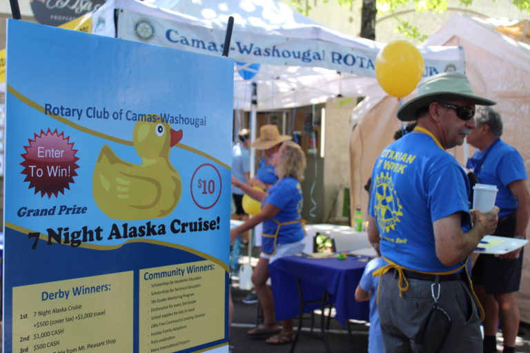 (Photo by Kelly Moyer/Post-Record) Camas-Washougal Rotary Club members sell Ducky Derby tickets at the 2019 Camas Days on Friday, July 26. The Ducky Derby will take place at noon, Sunday, July 28, at the Third Avenue Bridge in downtown Camas. 