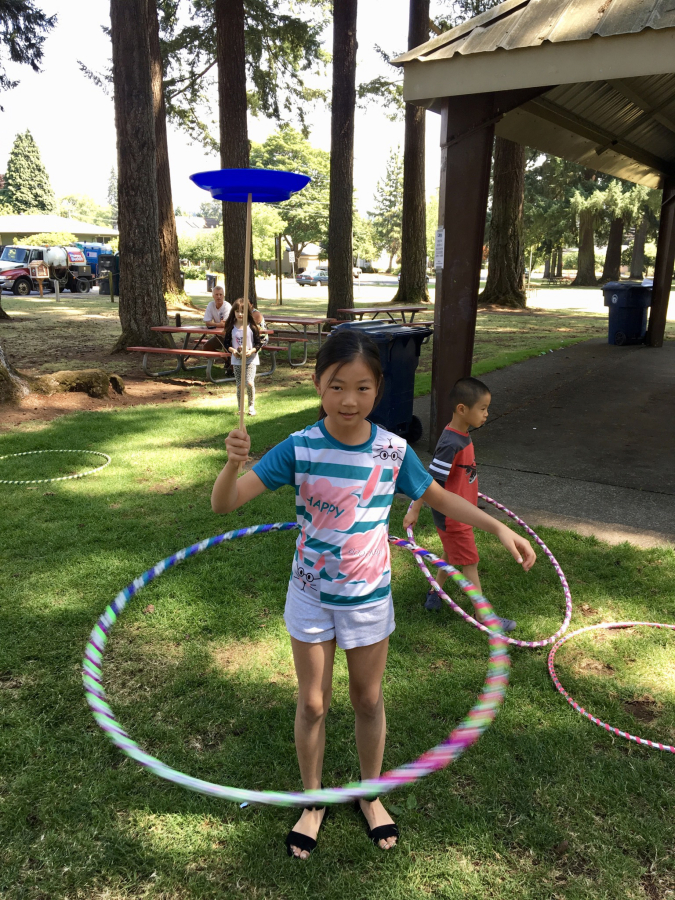 Children play at a Family Fun Fridays event in July 2018 at Crown Park in Camas.