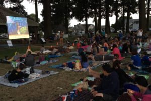 Camas area families watch "Moana" at Crown Park in 2017, during the annual city of Camas' Parks and Recreation's "Movies in the Park" series, which takes place every Friday evening throughout the month of August. (Contributed photo courtesy of the city of Camas Parks and Recreation)