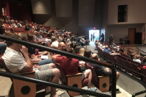 About 150 people gather in the Washburn Performing Arts Center at Washougal High School to remember the life of their teacher, coach and motivator, George Cass, on July 27. (Wayne Havrelly/Post-Record)