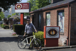 Jeff Cary, the new owner of Camas Bike and Sport, shows off one of his store's new e-bikes.  Cary worked at the shop for 18 months before buying the business. (Photos by Wayne Havrelly/Post-Record)