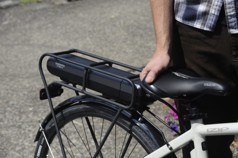 The batteries on e-bikes are typically located on the back.