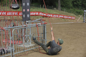 Course manager Jonathon Holcomb tests a Spartan race obstacle known as "the Hercules hoist" at the Washougal MX Park.