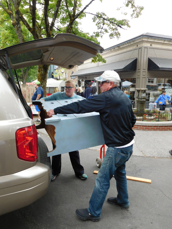 Shoppers score antique furniture at the Downtown Camas Vintage &amp; Art Street Faire in August 2018. The annual event, which returns for its 11th year on Saturday, Aug.