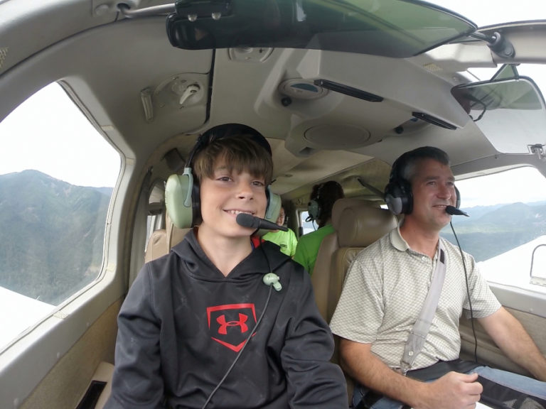 Port of Camas-Washougal commissioner John Spencer, right, takes Cooper Woodward of Camas for an airplane ride in 2016. Earlier this year Spencer authored a business implementation plan for Grove Field and presented it to his fellow commissioners, who decided to delay action on the plan indefinitely.